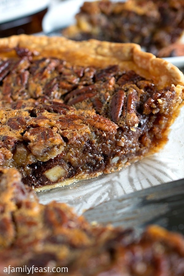 Chocolate Bourbon Pecan Pie - A classic dessert but kicked up a notch by adding chocolate chips and bourbon to the pecan pie filling. Incredible!