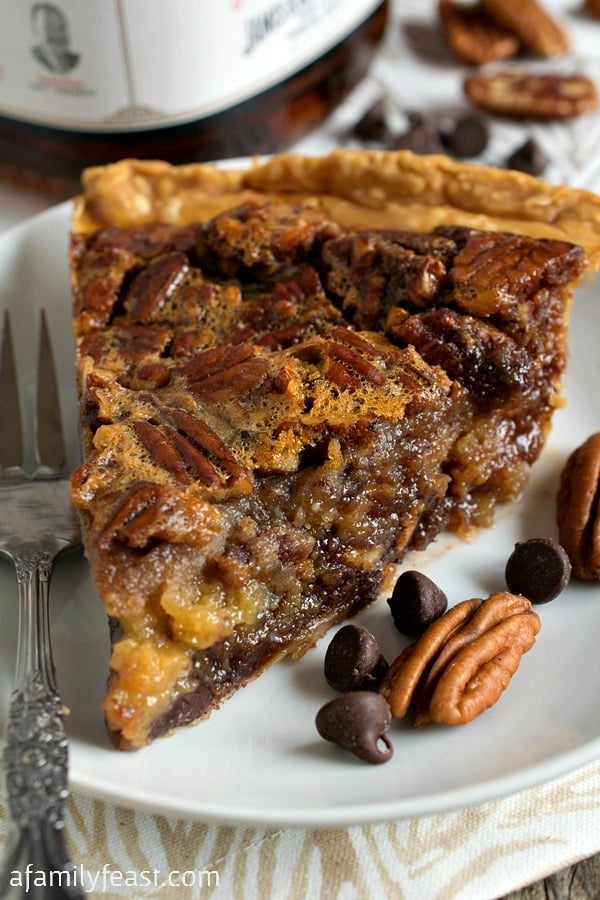 Chocolate Bourbon Pecan Pie - A classic dessert but kicked up a notch by adding chocolate chips and bourbon to the pecan pie filling. Incredible!