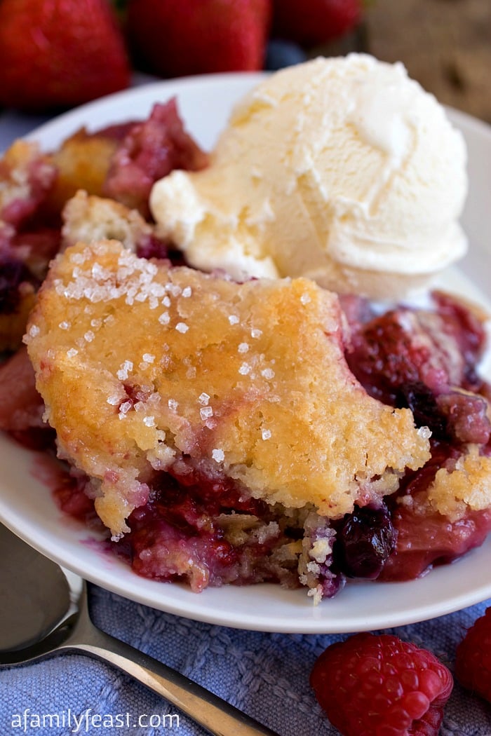 Mixed Berry Cobbler - The ultimate summertime dessert! Strawberries, blueberries and raspberries with a perfect cobbler cake topping!