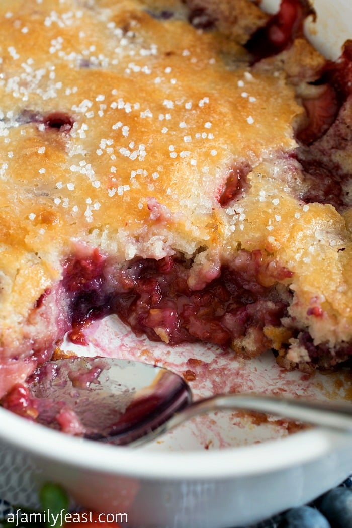 Mixed Berry Cobbler - The ultimate summertime dessert! Strawberries, blueberries and raspberries with a perfect cobbler cake topping!