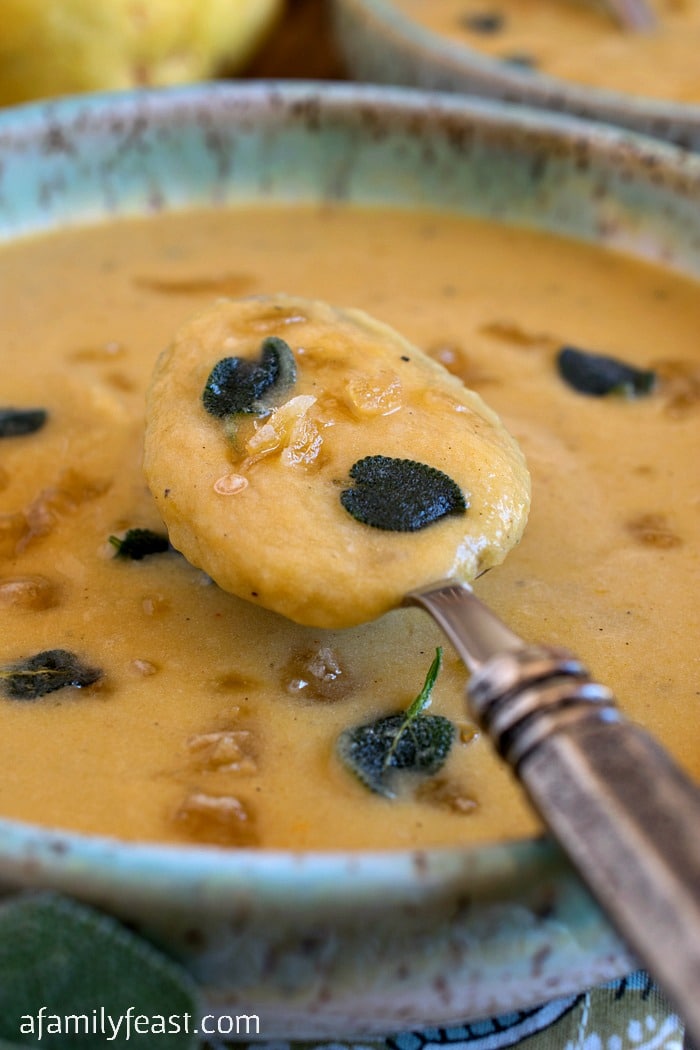 Acorn Squash and Pear Soup - A delicious taste of Fall! This creamy soup is made with acorn squash and pears with crispy sage and crystallized ginger on top.
