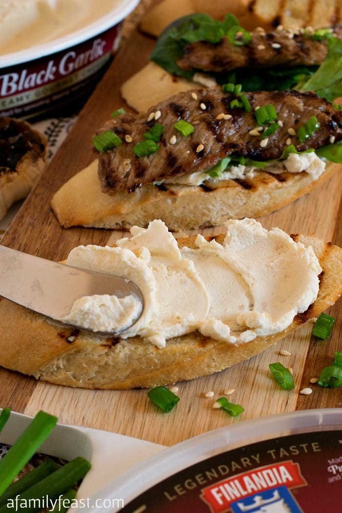 Black Garlic Bulgogi Beef Crostini - Creamy cheese flavored with black garlic spread on crostini and topped with bulgogi beef. This delicious appetizer has fantastic flavors!