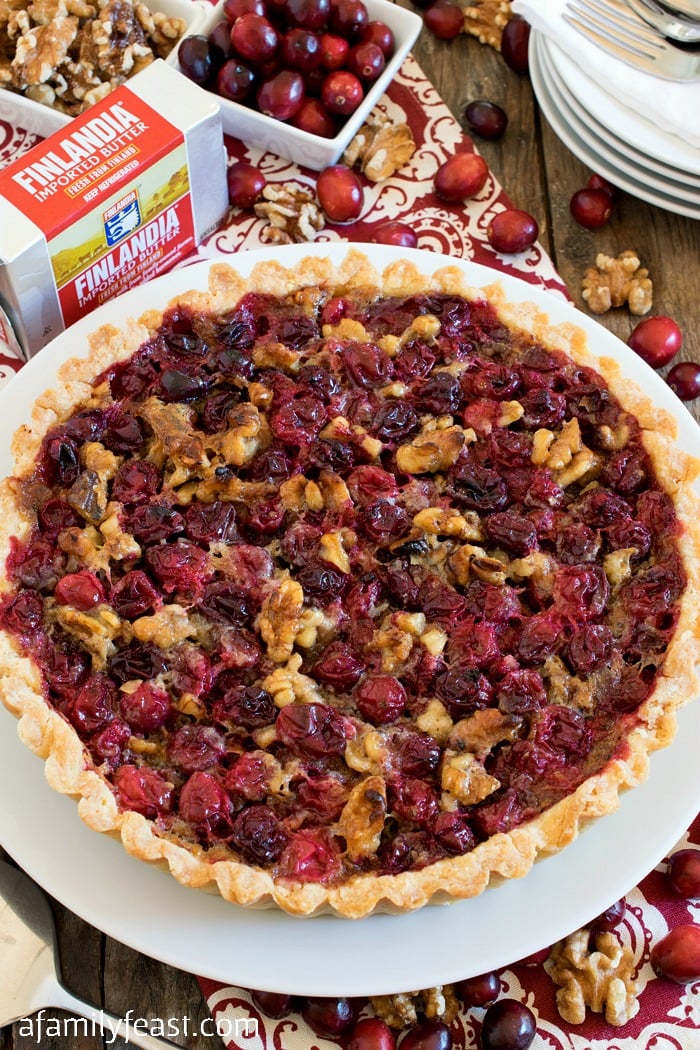 Cranberry Walnut Tart - A rich cranberry and walnut filling in a buttery shortbread shell. Perfectly sweet, tart and delicious!