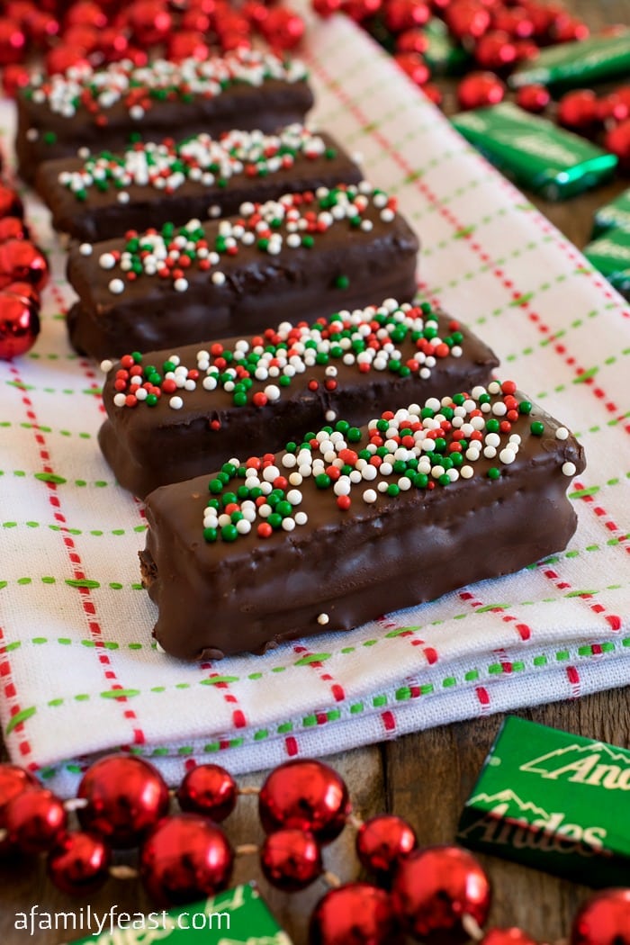 Chocolate Mint Sugar Wafers - Andes mints sandwiched between sugar wafer cookies, then dipped in chocolate. A quick, easy and festive idea for your holiday cookie tray!