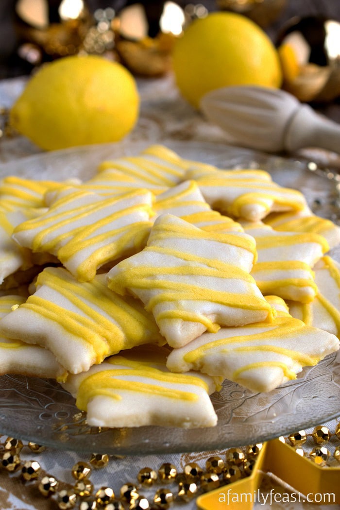 Lemon Star Cookies - Tender, sweet sugar cookies topped with a lemon icing. Absolutely delicious!