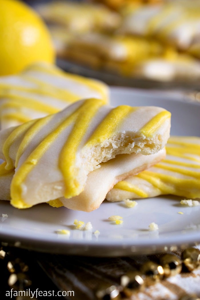 Lemon Star Cookies - Tender, sweet sugar cookies topped with a lemon icing. Absolutely delicious!