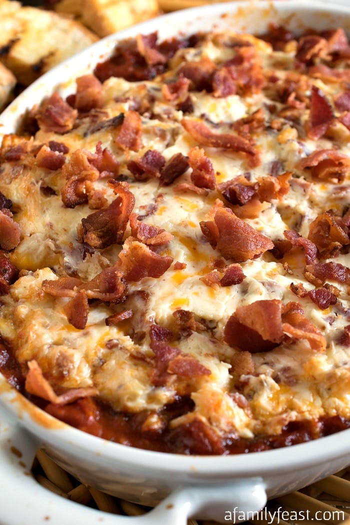 Creamy Roasted Tomato Bacon Dip - Roasted tomatoes topped with a creamy bacon and cream cheese topping - plus more bacon on top! 