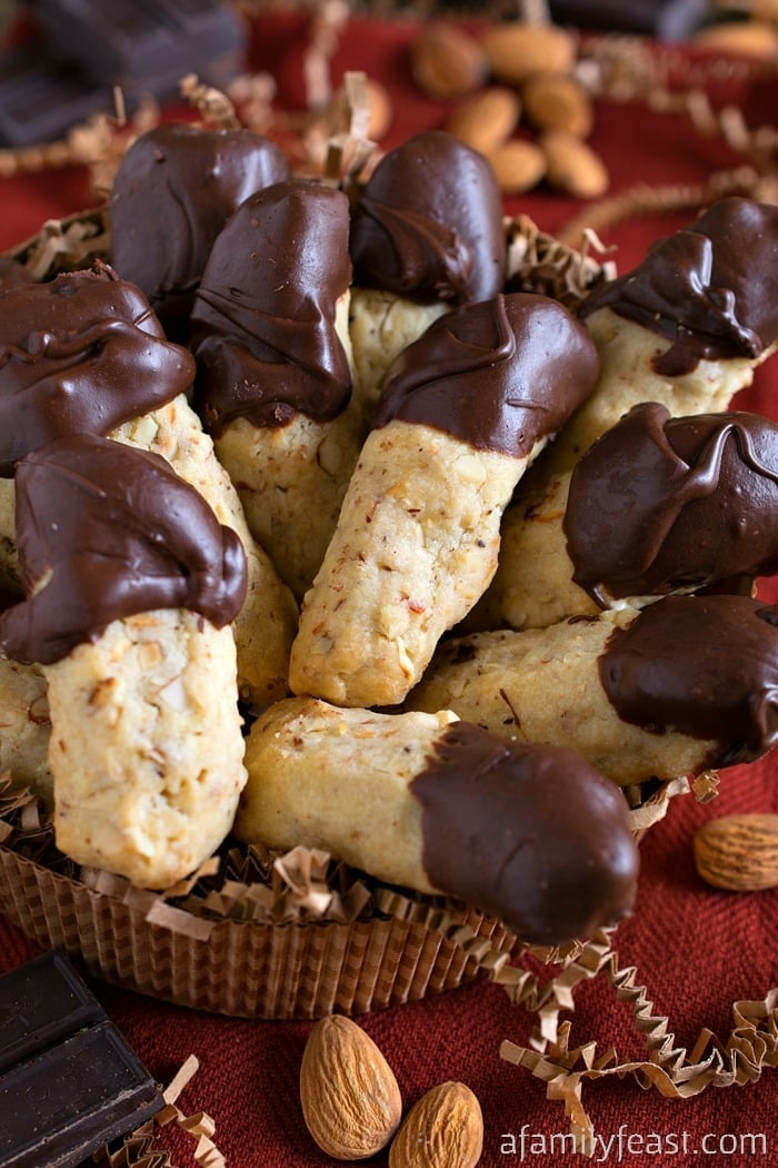 Chocolate Dipped Almond Fingers - Light and crumbly almond-stuffed shortbread cookies dipped in chocolate. Cookie perfection!