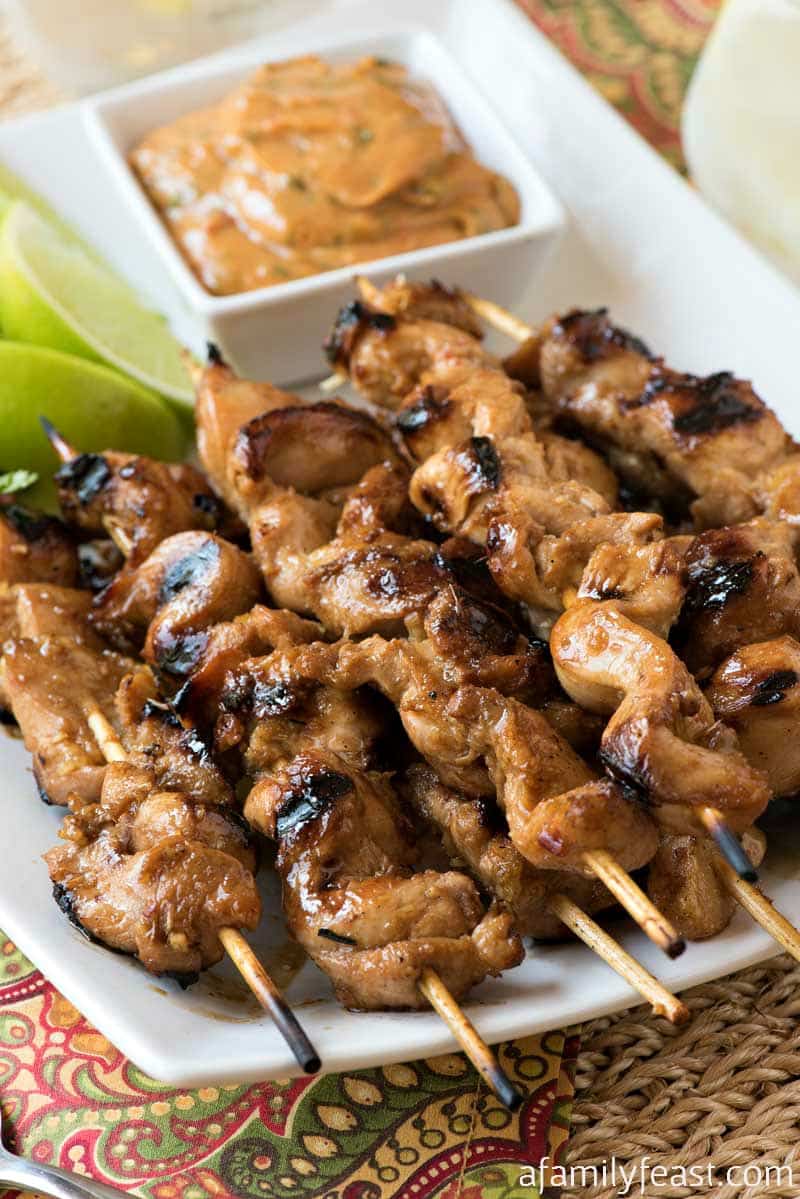 Grilled Chicken Skewers with Thai Chili Peanut Sauce - Tender strips of grilled chicken served with the most amazing peanut sauce!