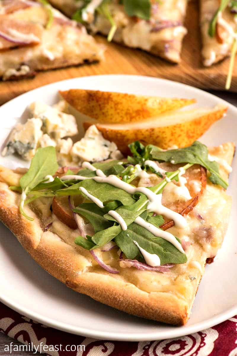 This Pear and Gorgonzola Pizza with Arugula and Ranch Dressing is a unique pizza with a surprisingly delicious combination of flavors.