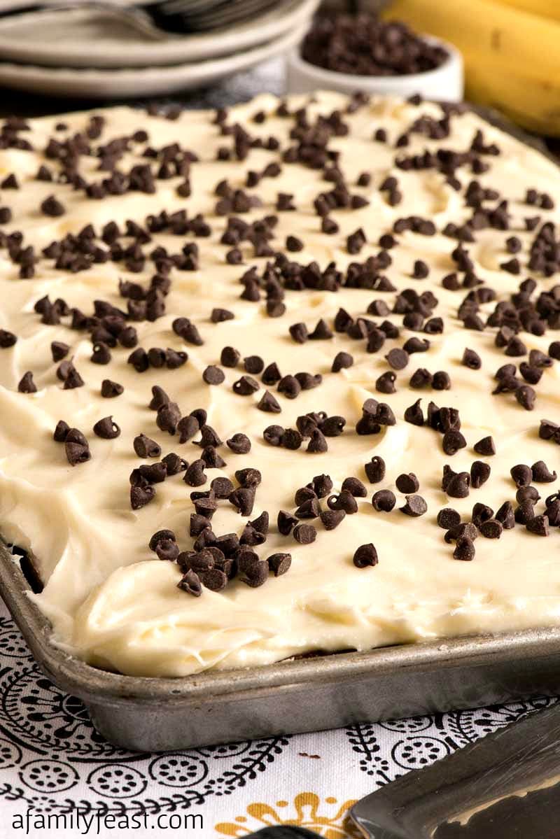 Banana Chocolate Chip Sheet Cake with Cream Cheese Frosting - Easy, moist and delicious! Easily the best sheet cake you'll ever make.