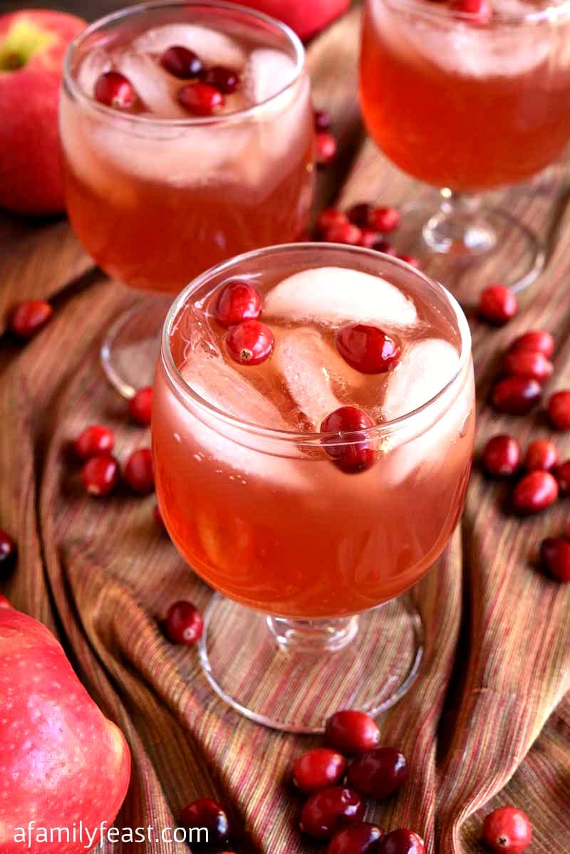 Our Autumn Cape Codder a classic cocktail updated with Fall flavors! Cranberry juice, vodka, apple cider, and apple liqueur plus fresh cranberries for garnish!