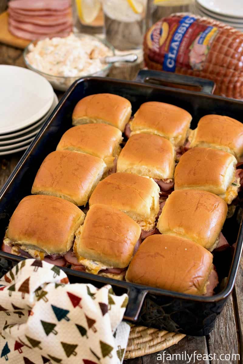 Mississippi Sin Ham Sliders - Delicious ham sliders with a zesty cheesy topping - just like the Mississippi Sin Dip!