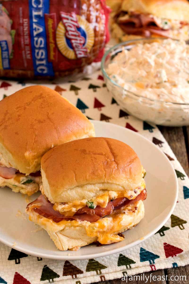 Mississippi Sin Ham Sliders - Delicious ham sliders with a zesty cheesy topping - just like the Mississippi Sin Dip!