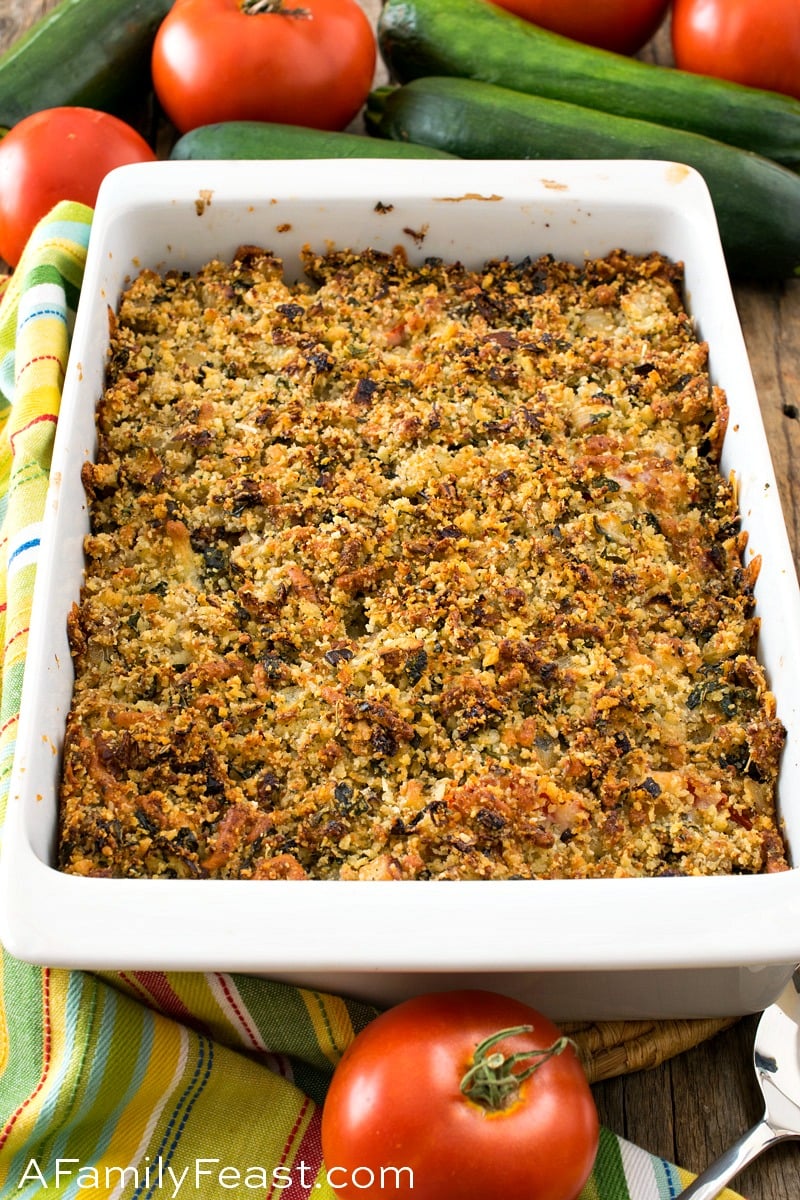 Our Baked Tomatoes and Zucchini with Cheddar Parmesan Parmesan Topping makes a delicious meatless meal or side dish that kids and grown-ups will both love. Baked Tomatoes and Zucchini with Cheddar Parmesan Panko Topping