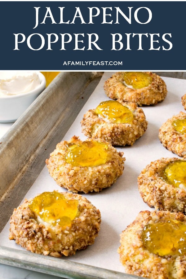 Jalapeño Popper Bites are a savory, cheddar cheese cookie filled with cream cheese and topped with homemade jalapeño jelly. Jalapeño Popper Bites - A Family Feast