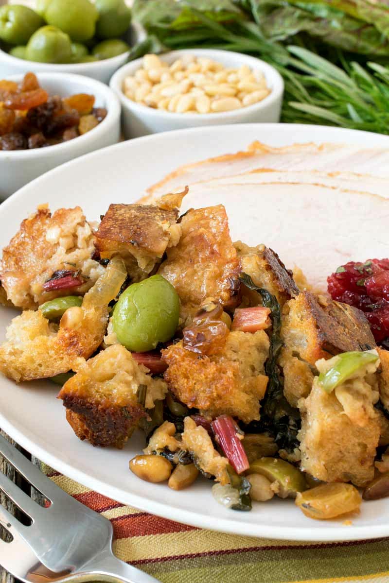 Italian Mother-In-Law Dressing combines crusty bread, leafy Swiss chard, briny olives, sweet raisins, and crunchy pine nuts in one super delicious side dish! Italian Mother-In-Law Dressing