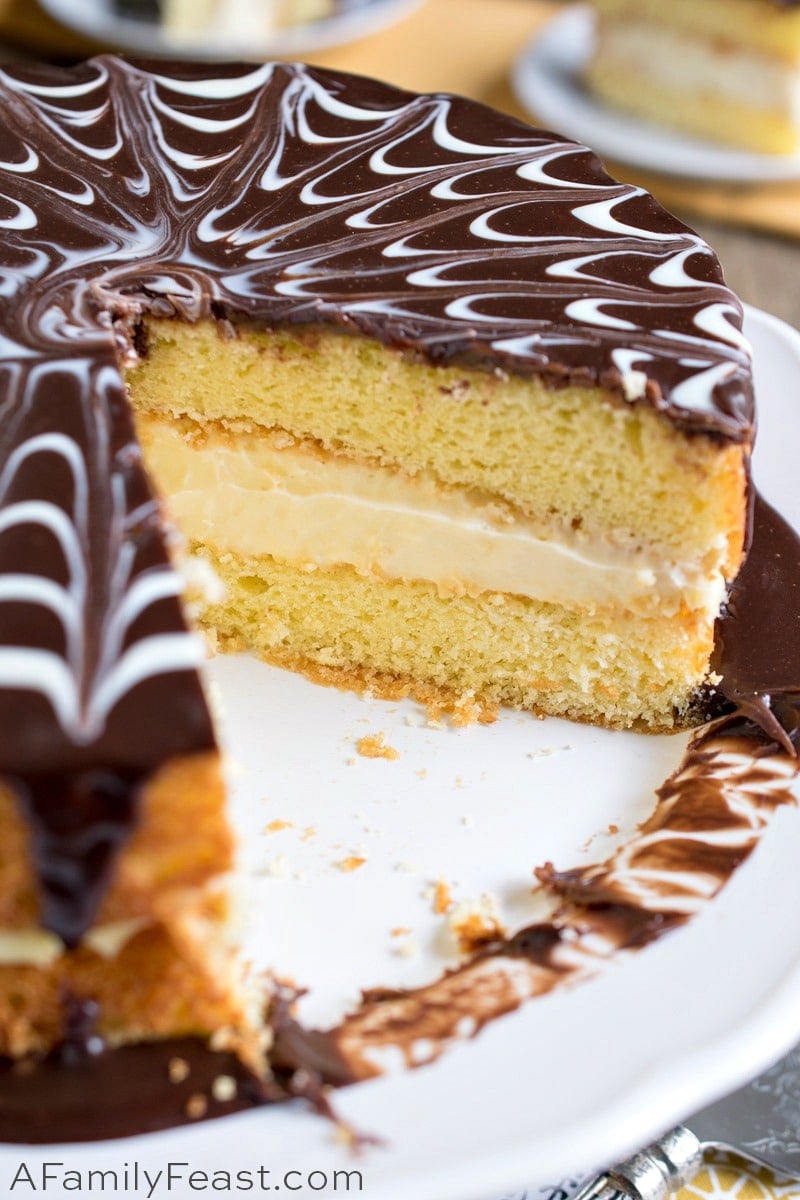 Boston Cream Pie is a buttery yellow sponge cake, filled with creamy custard, and topped with a chocolate ganache. Boston Cream Pie